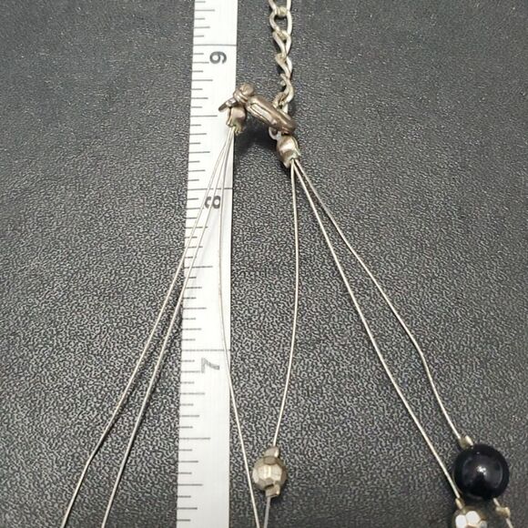 Silver tone black flower floating necklace - Picture 9 of 11